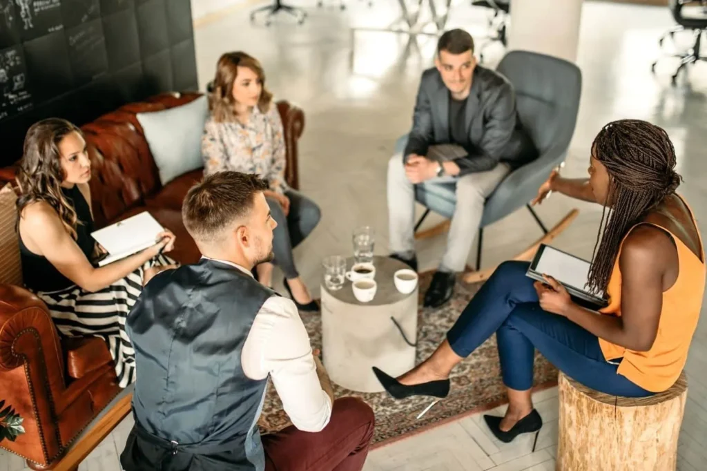 Peer Sales Agency sales team meeting to discuss strategy.