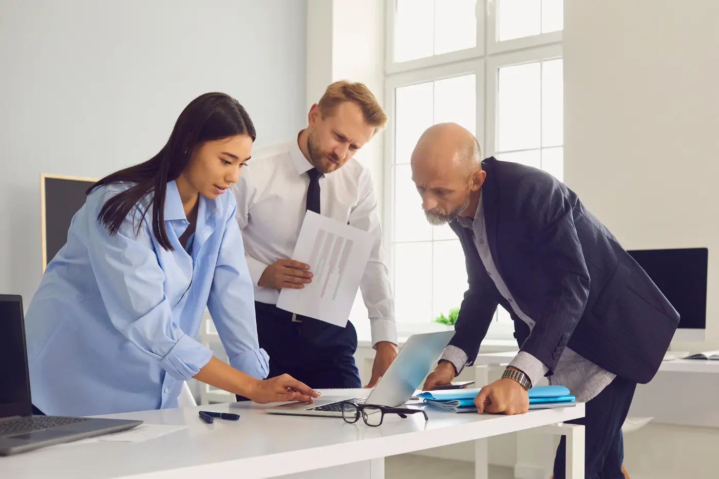 A group of individuals auditing their B2B website to prepare for a redesign.