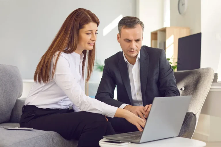 Two people looking at a b2b wordpress website.