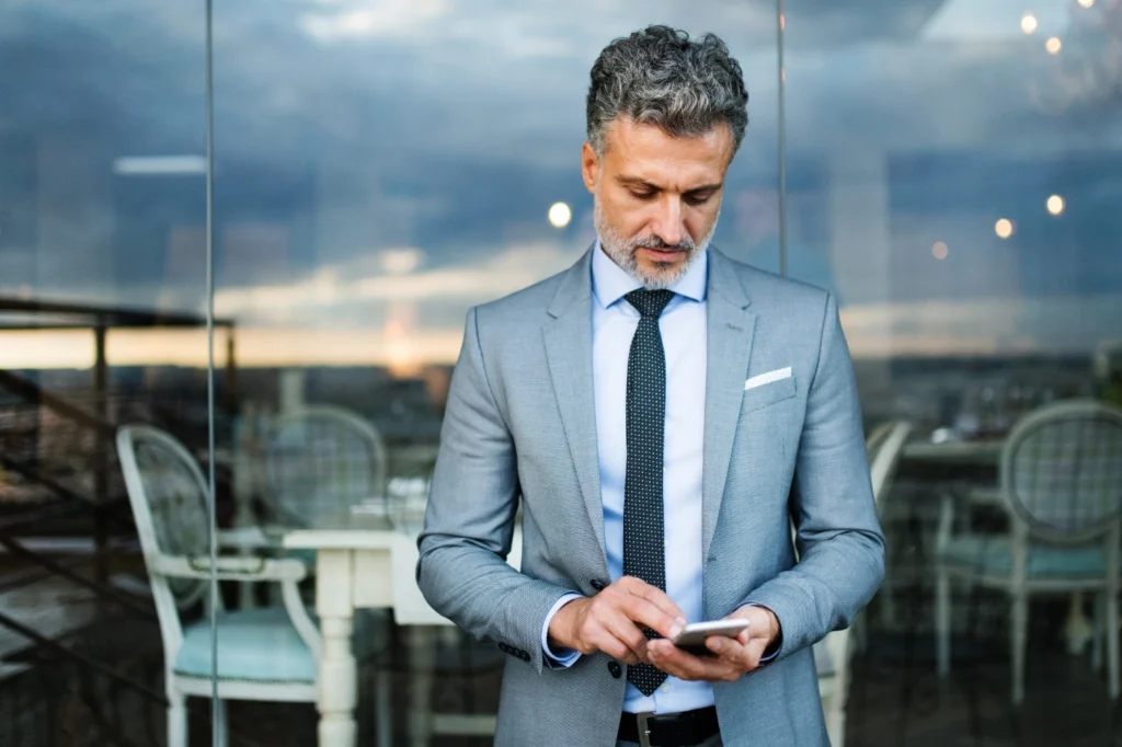 Write concise alt text that uses the primary keyword from the SEO section of this document and describes the image and its relevance to the content. (e.g., Computer showing an SEO audit)> Marketing and sales executive making outbound calls.