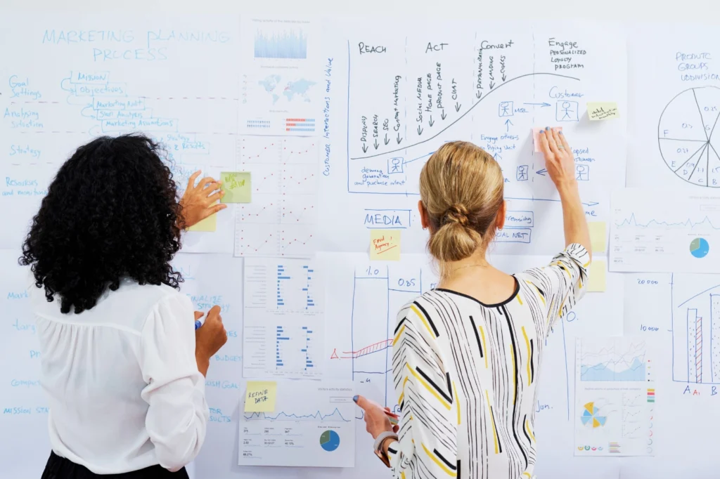 Two marketing professionals brainstorming a repeatable outbound prospecting motion