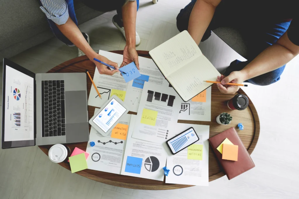 A B2B sales leader reviewing a sales enablement strategy framework with pipeline metrics and content assets mapped to the buyer's journey.